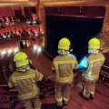 Los bomberos de Huesca, en el interior del Teatro Olimpia tras el incendio de este domingo.