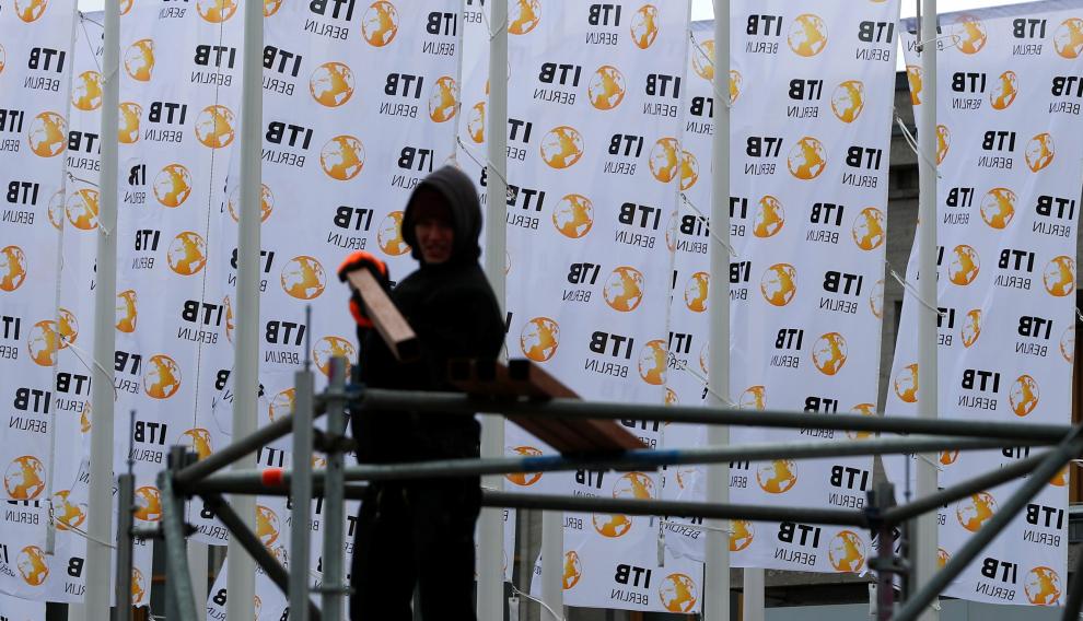 A worker makes preparations for the upcoming International Tourism Trade Fair ITB in Berlin