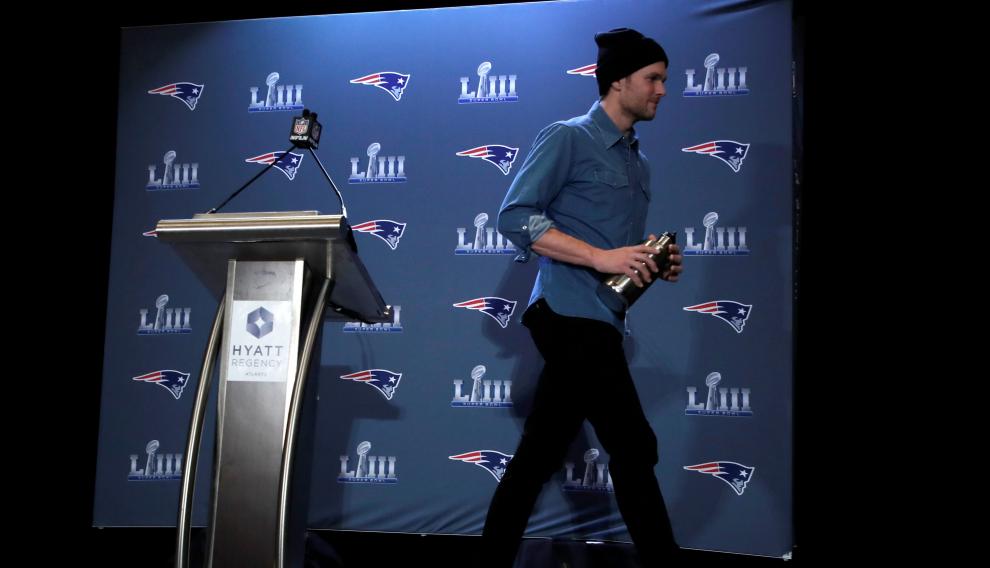 FILE PHOTO: New England Patriots quarterback Tom Brady walks from the podium after speaking at a press conference ahead of Super Bowl LIII in Atlanta