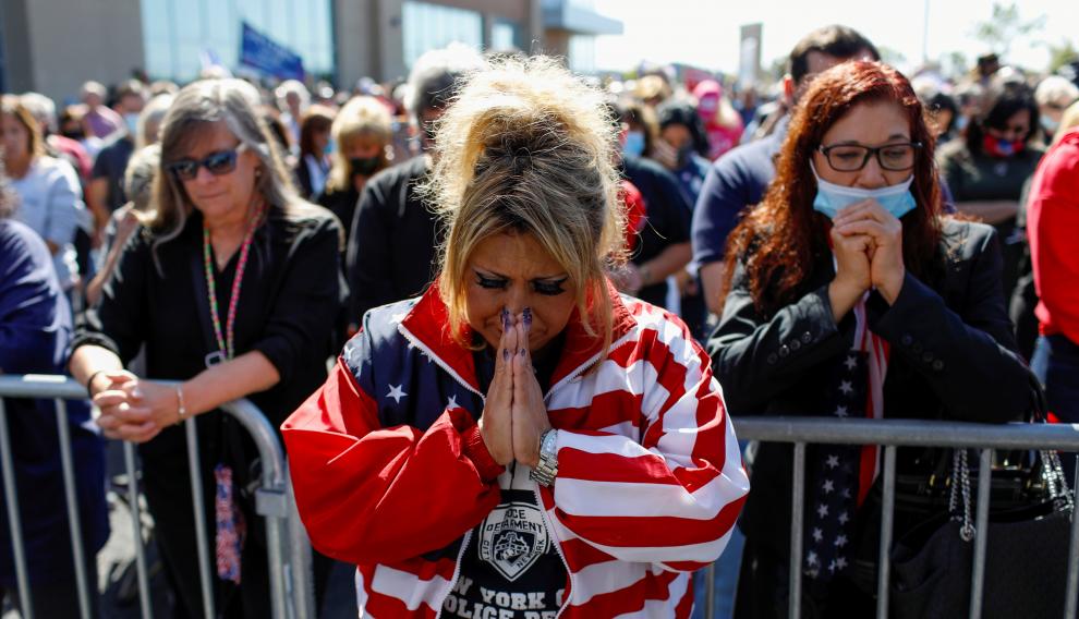 People pray for U.S. President Donald Trump, who was diagnosed with the coronavirus disease (COVID-19), in New York City