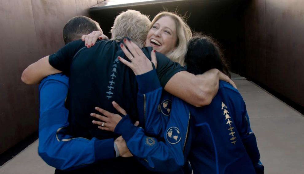 Virgin Galactic's chief astronaut instructor Beth Moses embraces Richard Branson at Spaceport America