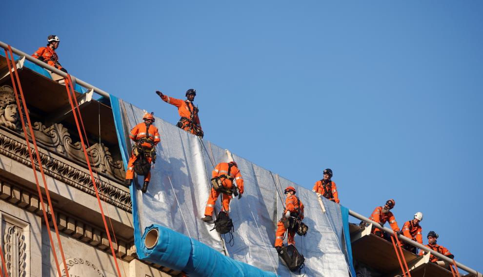 Wrapping of landmark Arc de Triomphe monument in Paris