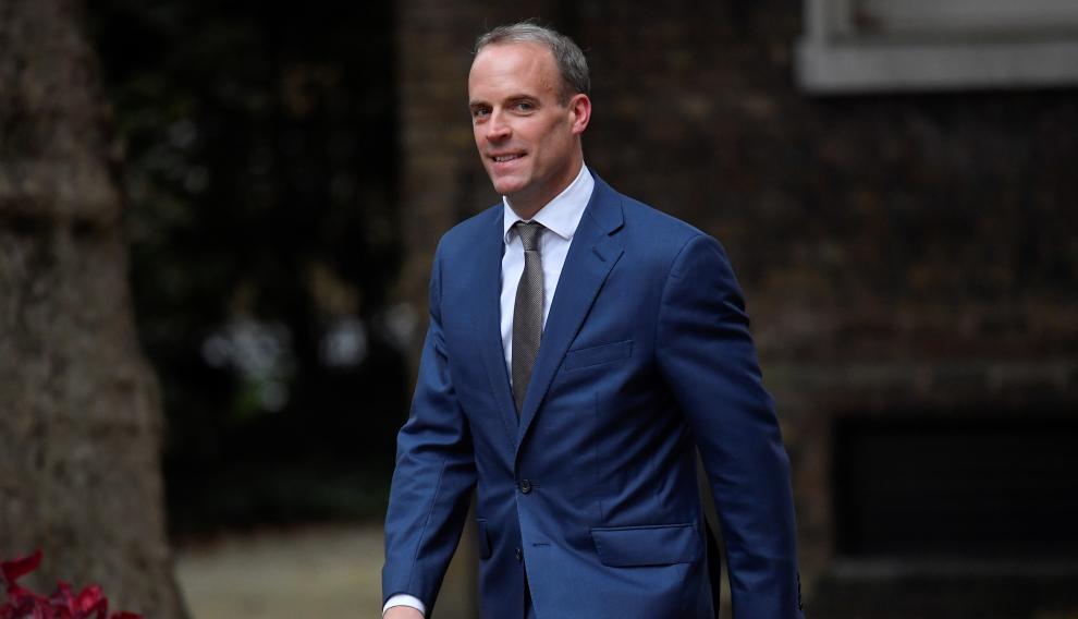 Dominic Raab walks outside Downing Street in London