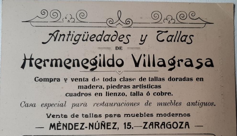 Un cartel de Hermenegildo Villagrasa y su tienda de anticuario en Zaragoza.