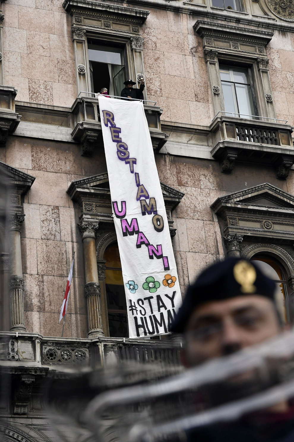 Milan (Italy), 18/05/2019.- A banner reading, both in English and in Italian, 'Let's stay human', has been unrolled during the meeting of European populist parties organized by Italian Interior Minister, Deputy Premier and leader of Italian party 'Lega' (League), Matteo Salvini, in Duomo square in Milan, Italy, 18 May 2019. A man dressed as Zorro with a plastic sword in his hand appeared from the balcony from which it was unrolled. (Elecciones, Italia) EFE/EPA/FLAVIO LO SCALZO Election campaign rally of the Lega party in Milan