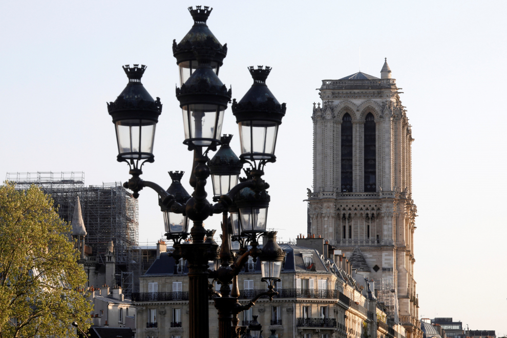 A view shows the Notre-Dame de Paris Cathedral, which was damaged in a devastating fire one year ago, as the coronavirus disease (COVID-19) lockdown slows down its restoration in Paris, France, April 11, 2020. Picture taken April 11, 2020. REUTERS/Charles Platiau [[[REUTERS VOCENTO]]] FRANCE-NOTREDAME/ANNIVERSARY