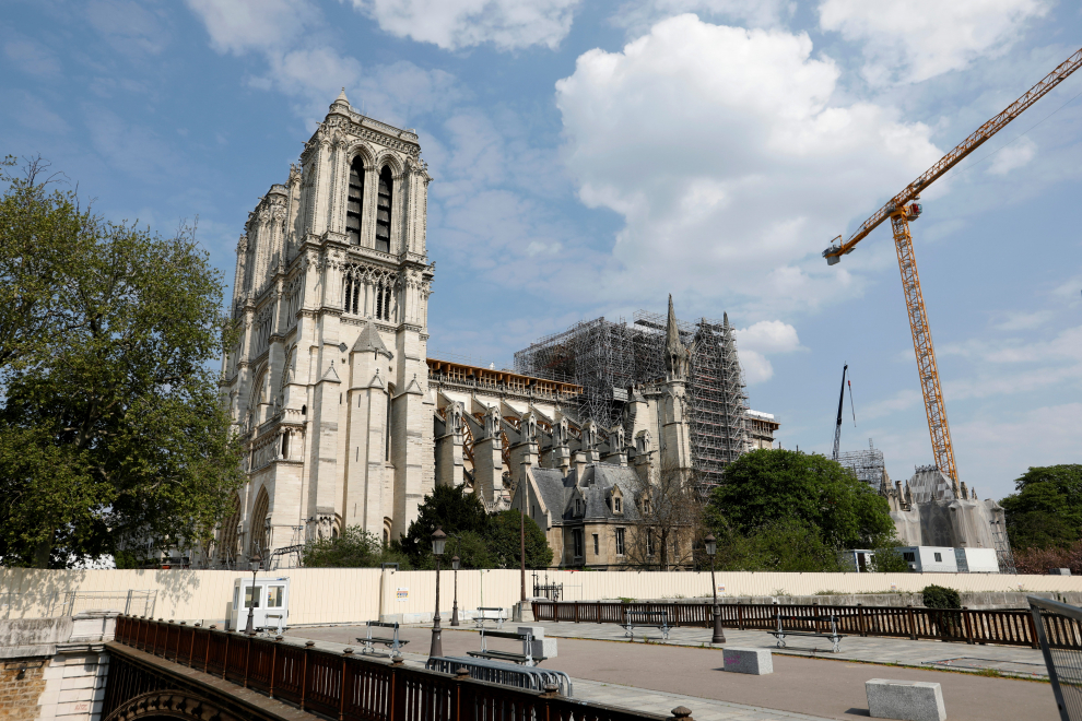 A view shows the Notre-Dame de Paris Cathedral, which was damaged in a devastating fire one year ago, as the coronavirus disease (COVID-19) lockdown slows down its restoration in Paris, France, April 11, 2020. Picture taken April 11, 2020. REUTERS/Charles Platiau [[[REUTERS VOCENTO]]] FRANCE-NOTREDAME/ANNIVERSARY