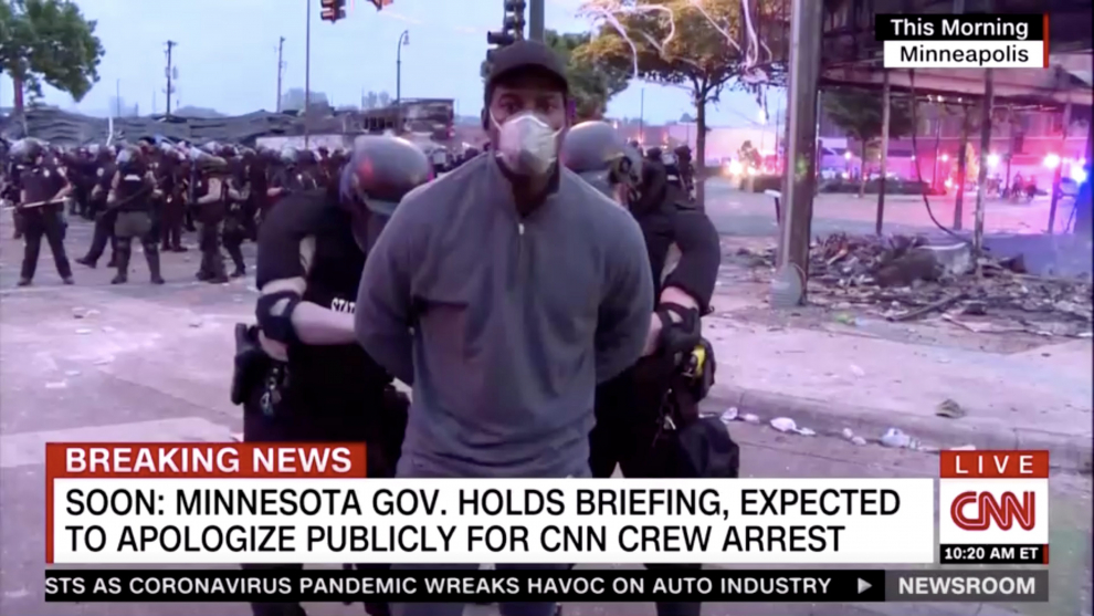 Police arrest a member of a CNN crew broadcasting live while covering protests related to the death of of African-American man George Floyd, in Minneapolis