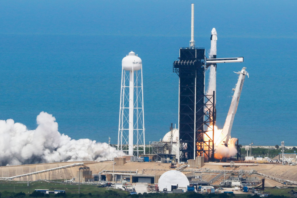 A SpaceX Falcon 9 rocket and Crew Dragon spacecraft carrying NASA astronauts Douglas Hurley and Robert Behnken launches, from Cape Canaveral