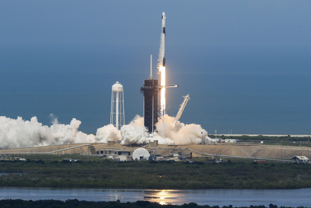A SpaceX Falcon 9 rocket and Crew Dragon spacecraft carrying NASA astronauts Douglas Hurley and Robert Behnken launches, from Cape Canaveral