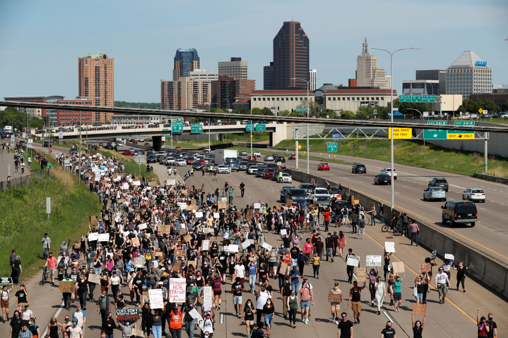 People rally against the death in Minneapolis police custody of George Floyd, in Saint Paul
