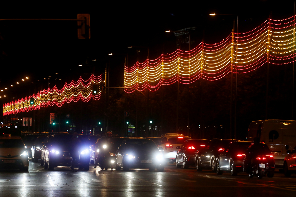 A woman stands near a part of one kilometre-long Christmas illuminations with the colours of the Spanish flag, amid the coronavirus disease (COVID-19) outbreak in Madrid, Spain, November 26, 2020. REUTERS/Sergio Perez[[[REUTERS VOCENTO]]] CHRISTMAS-SEASON/SPAIN-LIGHTS