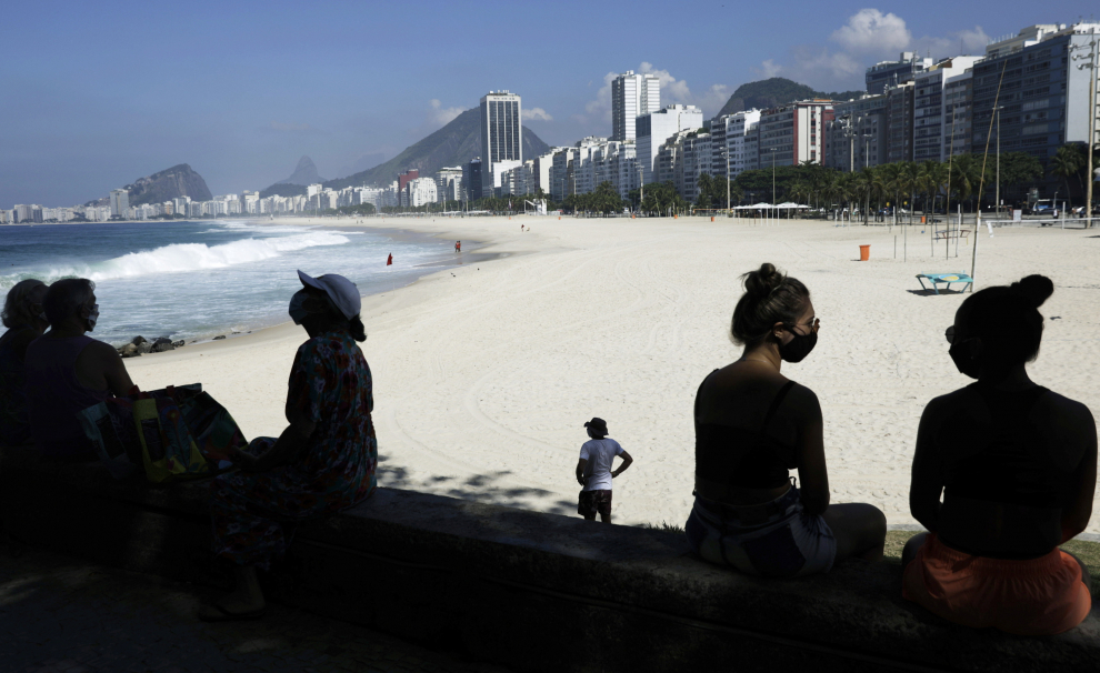 Lifeguards are pictured in Leme beach, after all beaches got closed as a restrictive measure to contain the outbreak of the coronavirus disease (COVID-19), in Rio de Janeiro, Brazil, March 20, 2021. REUTERS/Ricardo Moraes[[[REUTERS VOCENTO]]] HEALTH-CORONAVIRUS/BRAZIL