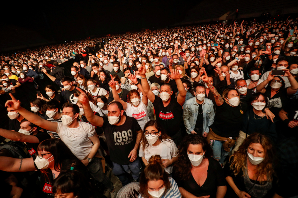 A couple wearing protective masks attends a concert of Love HEALTH-CORONAVIRUS/SPAIN- CONCERT