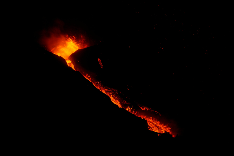 Lava and smoke rise following the eruption of a volcano on the Canary Island of La Palma, in El Paso, Spain, September 25, 2021. Picture taken with a long exposure. REUTERS/Jon Nazca[[[REUTERS VOCENTO]]] SPAIN-VOLCANO/