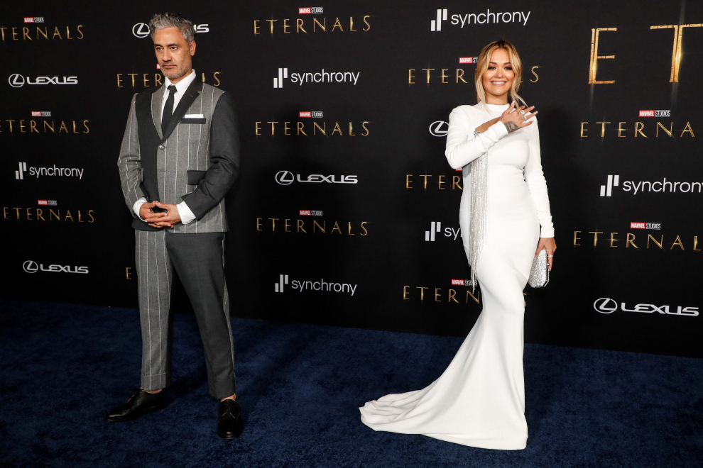 Singer Rita Ora and director Taika Waititi pose at the premiere for the film Eternals in Los Angeles, California, U.S. October 18, 2021. REUTERS/Mario Anzuoni[[[REUTERS VOCENTO]]] FILM-ETERNALS/PREMIERE