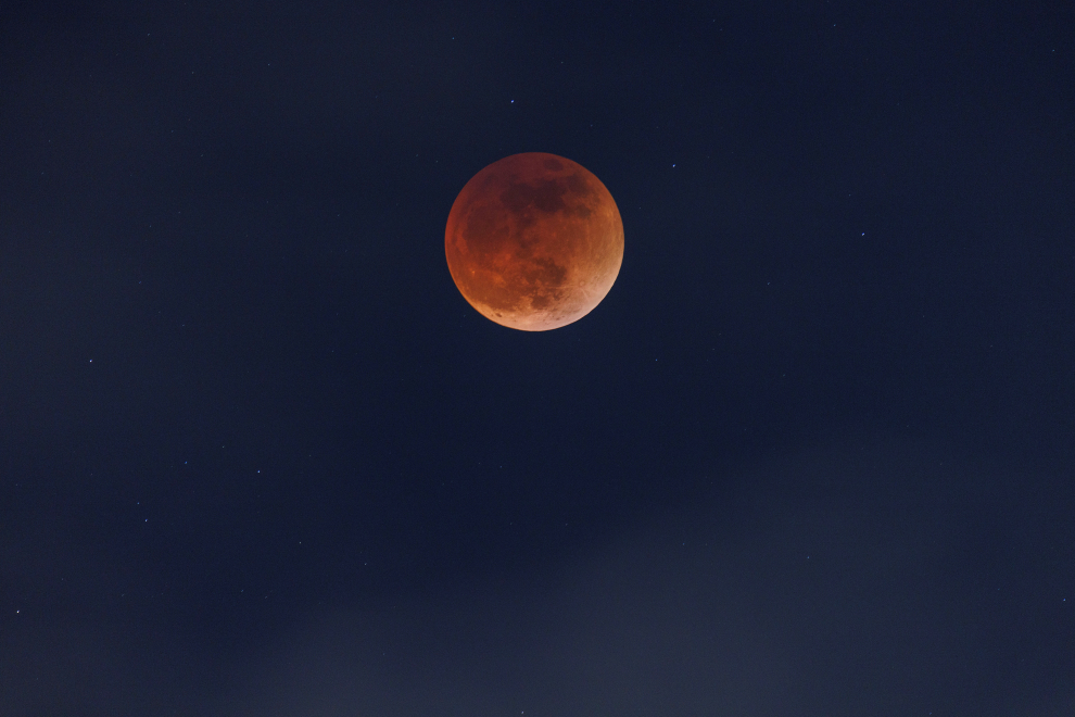Clouds roll in as a full moon moves through the shadow of the earth during a "Blood Moon" lunar eclipse in San Diego
