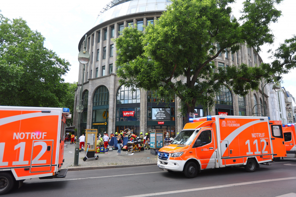 Emergency crews assist the injured, after a car crashed into a group of people, injuring dozens and killing at least one, at Tauentzien Strasse near Kaiser Wilhelm Gedaedtniskirche church in Berlin, Germany June 8, 2022. REUTERS/Fabrizio Bensch GERMANY-CRASH/