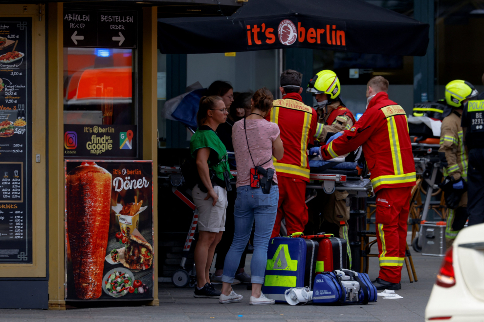 Emergency crews work at the site after a car crashed into a group of people, injuring dozens and killing at least one, at Tauentzien Strasse near Kaiser Wilhelm Gedaedtniskirche church in Berlin, Germany June 8, 2022. REUTERS/Fabrizio Bensch GERMANY-CRASH/