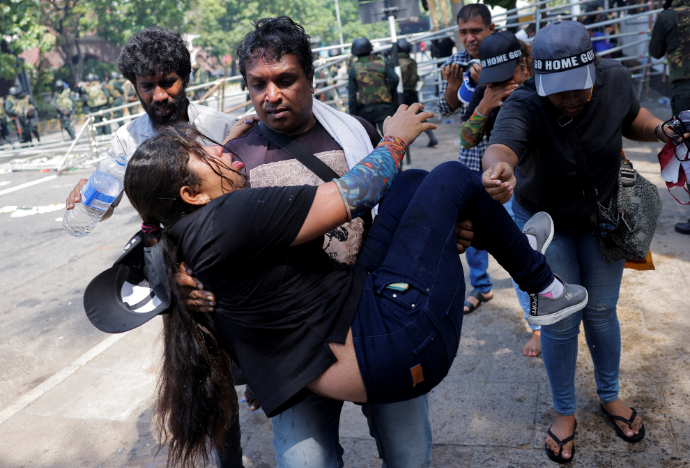 Police use tear gas and water cannons to disperse demonstrators near President's residence, in Colombo