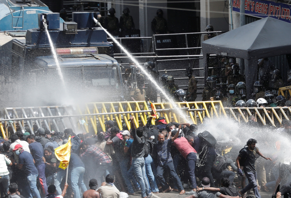 Police uses tear gas and water cannons to disperse demonstrators near President's residence, in Colombo