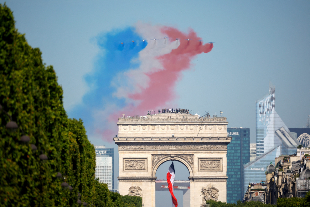 Aircraft of the Patrouille de France fly over the Champs-Elysees avenue during the annual Bastille Day military parade in Paris, France, July 14, 2022. REUTERS/Sarah Meyssonnier FRANCE-NATIONALDAY/PARADE
