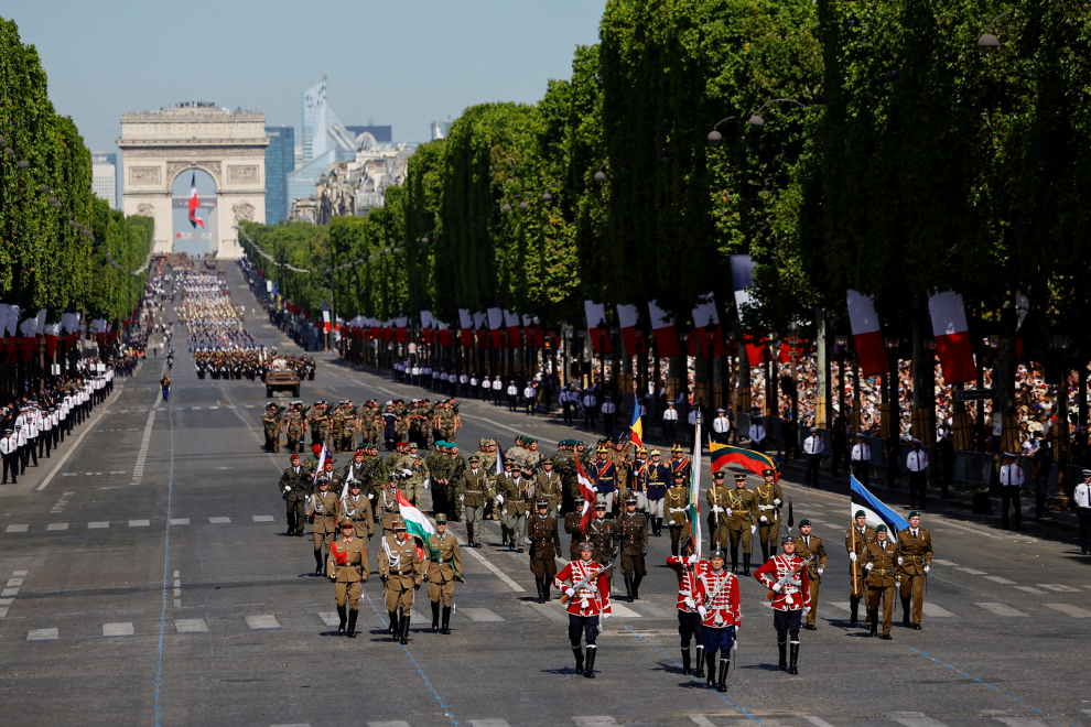 Military troops of Poland, Hungary, Lithuania and the Czech Republic take part in the annual Bastille Day military parade on the Champs-Elysees avenue in Paris, France, July 14, 2022. REUTERS/Sarah Meyssonnier FRANCE-NATIONALDAY/PARADE