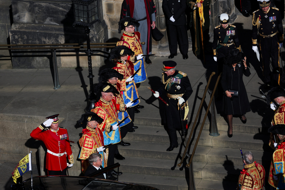 Britain's King Charles and Camilla, the Queen Consort, drive along the Royal Mile after leaving St Giles Cathedral in Edinburgh, Scotland, Monday, September 12, 2022. Jon Super/Pool via REUTERS BRITAIN-ROYALS/QUEEN