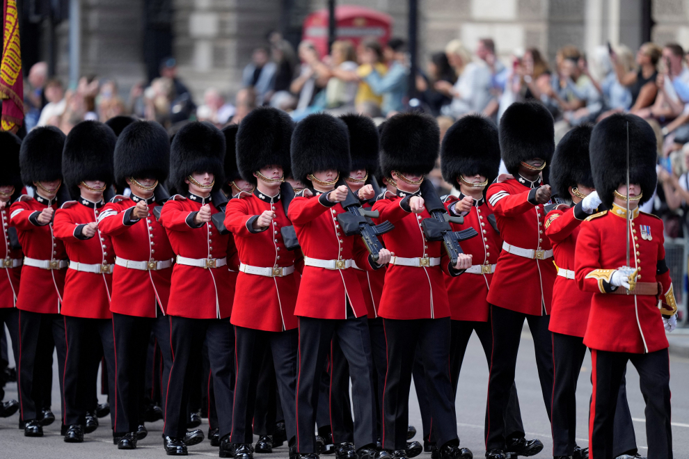 The Prince of Wales and the Duke of Sussex follow the coffin of Queen Elizabeth II, draped in the Royal Standard with the Imperial State Crown placed on top, as it is carried on a horse-drawn gun carriage of the King's Troop Royal Horse Artillery, during the ceremonial procession from Buckingham Palace to Westminster Hall, London, where it will lie in state ahead of her funeral on Monday. Picture date: Wednesday September 14, 2022. Ian West/Pool via REUTERS BRITAIN-ROYALS/QUEEN