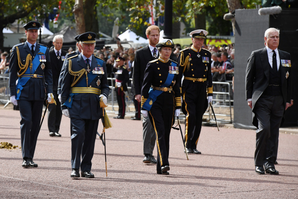 Guards march ahead of the procession of the Gun Carriage which will carry the coffin of Queen Elizabeth II from Buckingham Palace to Westminster Hall in London, Wednesday, Sept. 14, 2022. Franl Augstein/Pool via REUTERS BRITAIN-ROYALS/QUEEN