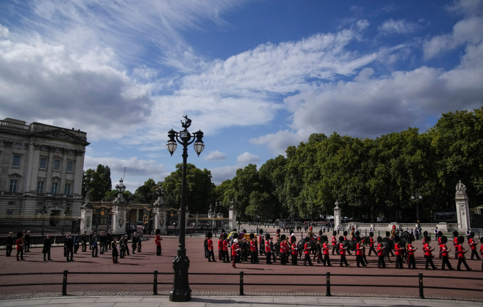 Police officers gather outside Buckingham Palace from where the coffin of late Queen Elizabeth II will depart in procession to Westminster Hall in London, Wednesday, Sept. 14, 2022. Vadim Ghirda/Pool via REUTERS BRITAIN-ROYALS/QUEEN