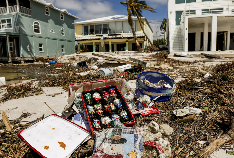 A mail box stands in flooded waters in front of damaged homes after Hurricane Ian made landfall in southwestern Florida in Punta Gorda, Florida, U.S., September 29, 2022. REUTERS/Shannon Stapleton STORM-IAN/CATTLE