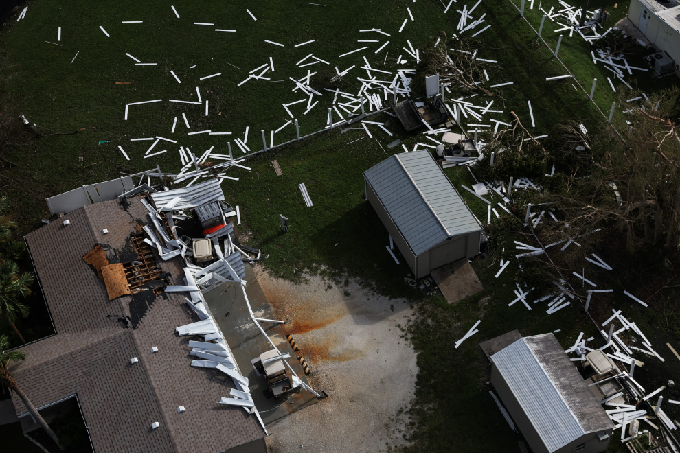 A mail box stands in flooded waters in front of damaged homes after Hurricane Ian made landfall in southwestern Florida in Punta Gorda, Florida, U.S., September 29, 2022. REUTERS/Shannon Stapleton STORM-IAN/FLORIDA