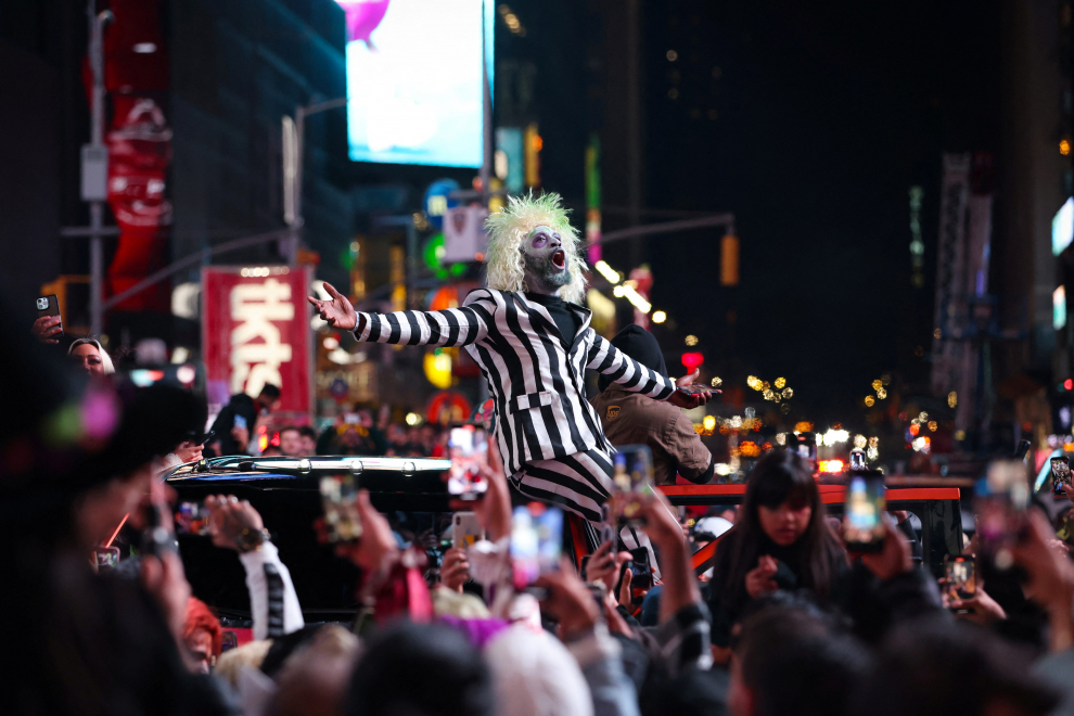 A person wears a costume in Times Square on Halloween in Manhattan, New York City, U.S., October 31, 2022.  REUTERS/Andrew Kelly HALLOWEEN-DAY/NEW YORK