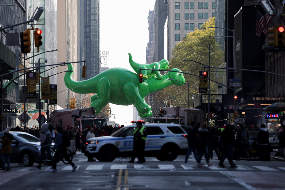 Baby Shark balloon is seen reflected during the 96th Macy's Thanksgiving Day Parade in Manhattan, New York City, U.S., November 24, 2022. REUTERS/Andrew Kelly USA-THANKSGIVING/PARADE