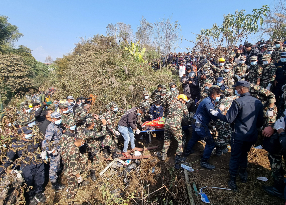 Crowds gather at the crash site of an aircraft carrying 72 people in Pokhara in western Nepal January 15, 2023. Sagar Raj Timilsina/Handout via REUTERS    THIS IMAGE HAS BEEN SUPPLIED BY A THIRD PARTY. MANDATORY CREDIT. NO RESALES. NO ARCHIVES. NEPAL-CRASH/