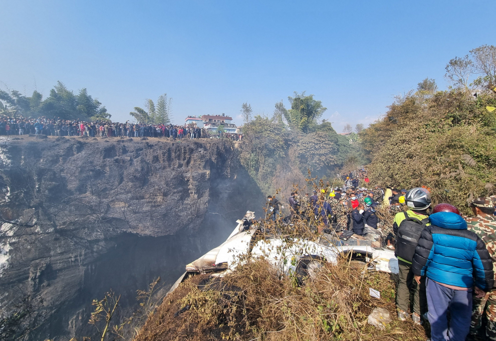 Rescue teams work to retrieve bodies at the crash site of an aircraft carrying 72 people in Pokhara in western Nepal January 15, 2023. Bijay Neupane/Handout via REUTERS THIS IMAGE HAS BEEN SUPPLIED BY A THIRD PARTY. MANDATORY CREDIT. NO RESALES. NO ARCHIVES. NEPAL-CRASH/