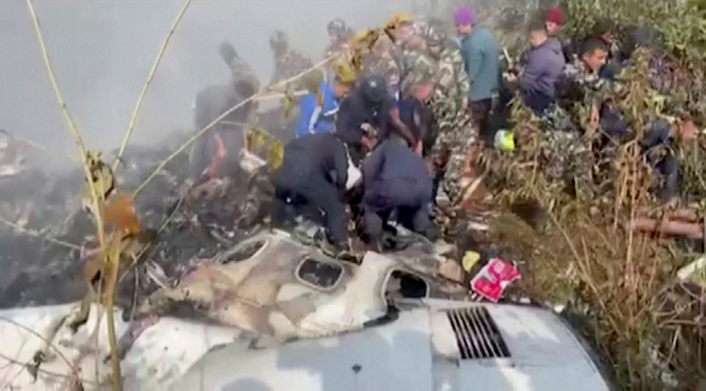 Rescuers work at the site of a plane crash in Pokhara, Nepal January 15, 2023, in this screen grab taken from a handout video. ANI/Handout/via REUTERS  ATTENTION EDITORS - THIS IMAGE HAS BEEN SUPPLIED BY A THIRD PARTY. INDIA OUT. NO COMMERCIAL OR EDITORIAL SALES IN INDIA NEPAL-CRASH/