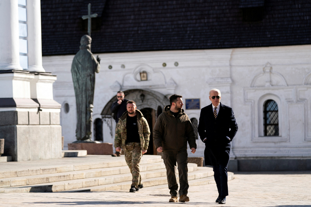 U.S. President Joe Biden walks with Ukrainian President Volodymyr Zelenskiy at St. Michael's Golden-Domed Cathedral during an unannounced visit, in Kyiv, Ukraine, Monday, Feb. 20, 2023. Evan Vucci/Pool via REUTERS UKRAINE-CRISIS/BIDEN