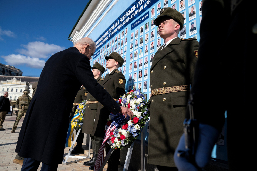 U.S. President Joe Biden participates in a wreath-laying ceremony with Ukrainian President Volodymyr Zelenskiy at the memorial wall outside of St. Michael's Golden-Domed Cathedral during an unannounced visit, in Kyiv, Ukraine, Monday, Feb. 20, 2023. Evan Vucci/Pool via REUTERS UKRAINE-CRISIS/BIDEN