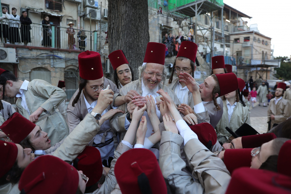 Ultra-Orthodox Jewish men and boys dressed in costumes celebrate the Jewish holiday of Purim, in Mea Shearim neighbourhood, in Jerusalem March 8, 2023. REUTERS/Ammar Awad RELIGION-PURIM/JERUSALEM