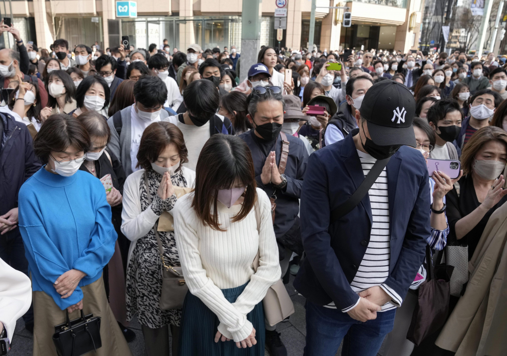 People pray towards the sea to mourn victims of the 2011 earthquake and tsunami that killed thousands and triggered the worst nuclear accident since Chernobyl on the day to mark the 12-year anniversary of the disaster, in Iwaki, Fukushima prefecture, Japan, March 11, 2023. REUTERS/Issei Kato JAPAN-FUKUSHIMA/ANNIVERSARY