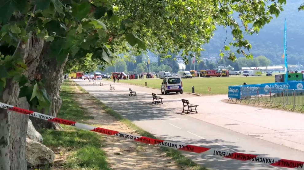 Medics and emergency personnel work at the site where a person wounded four children and an adult in a knife attack in a park in Annecy, France June 8, 2023. Florent Pecchio/L'essor Savoyard/Handout via REUTERS. IMAGE HAS BEEN SUPPLIED BY A THIRD PARTY. MANDATORY CREDIT. NO RESALES. NO ARCHIVES. FRANCE-SECURITY/