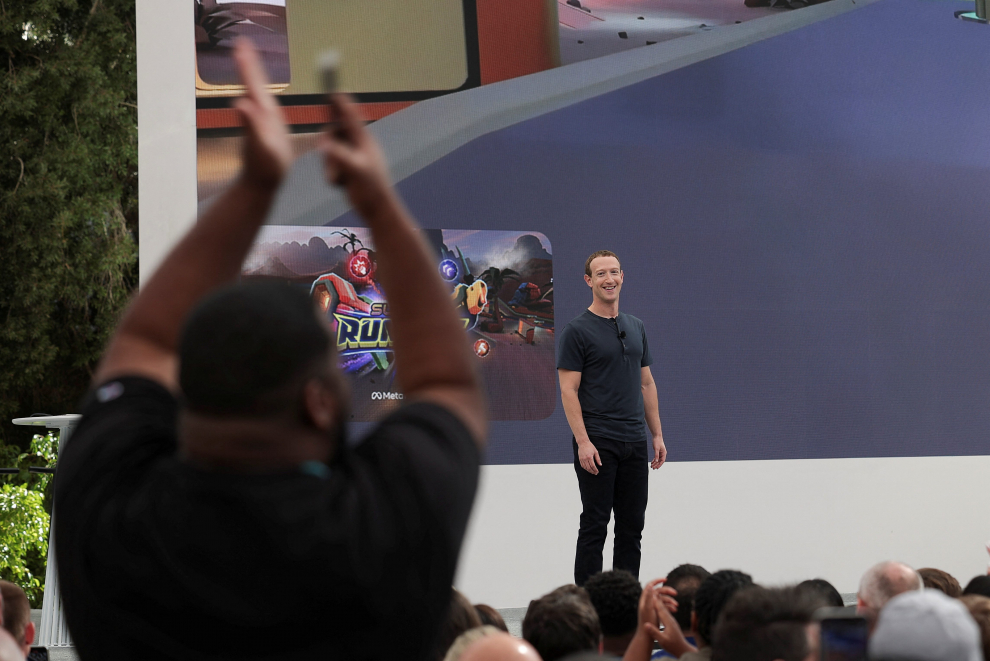 A man applauds, as Meta CEO Mark Zuckerberg delivers a speech at the Meta Connect event at the company's headquarters in Menlo Park, California, U.S., September 27, 2023. REUTERS/Carlos Barria META PLATFORMS-VIRTUAL REALITY/