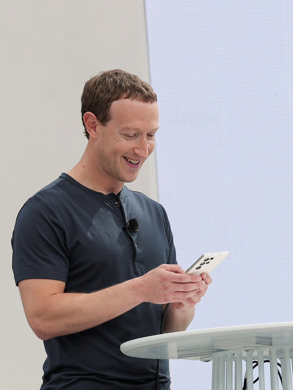 Meta CEO Mark Zuckerberg uses a cellphone, as he delivers a speech at the Meta Connect event at the company's headquarters in Menlo Park, California, U.S., September 27, 2023. REUTERS/Carlos Barria META PLATFORMS-VIRTUAL REALITY/