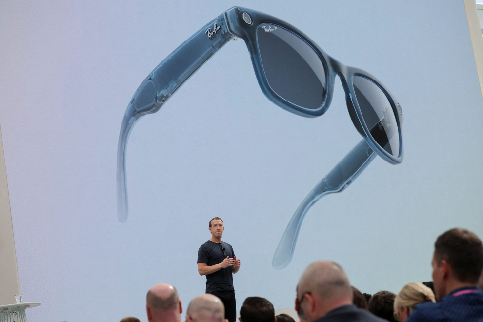 Meta CEO Mark Zuckerberg delivers a speech, as Ray-Ban smart glasses appear on screen, during the Meta Connect event at the company's headquarters in Menlo Park, California, U.S., September 27, 2023. REUTERS/Carlos Barria META PLATFORMS-VIRTUAL REALITY/