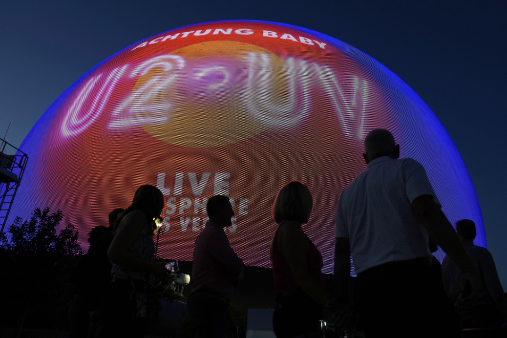 People arrive for the opening night of the Sphere and U2'S “UV Achtung Baby" show, Friday, Sept. 29, 2023, in Las Vegas. (AP Photo/John Locher)