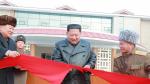 Yangdok County (Korea, Democratic People''s Republic Of), 08/12/2019.- A photo released by the official North Korean Central News Agency (KCNA) on 08 December 2019 shows Kim Jong Un (C), chairman of the Workers' Party of Korea and Supreme Leader of North Korea, cutting a ribbon during a ceremony for the completion of the Yangdok County Hot Spring Cultural Recreation Center in Yangdok County, North Korea. EFE/EPA/KCNA EDITORIAL USE ONLY Supreme Leader of North Korea Kim Jong Un opens Yangdok County Hot Spring Cultural Recreation Center