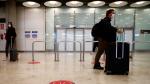 Passengers arrive at Adolfo Suarez Barajas airport in Madrid