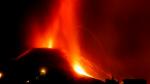 Lava and smoke rise following the eruption of a volcano on the Canary Island of La Palma